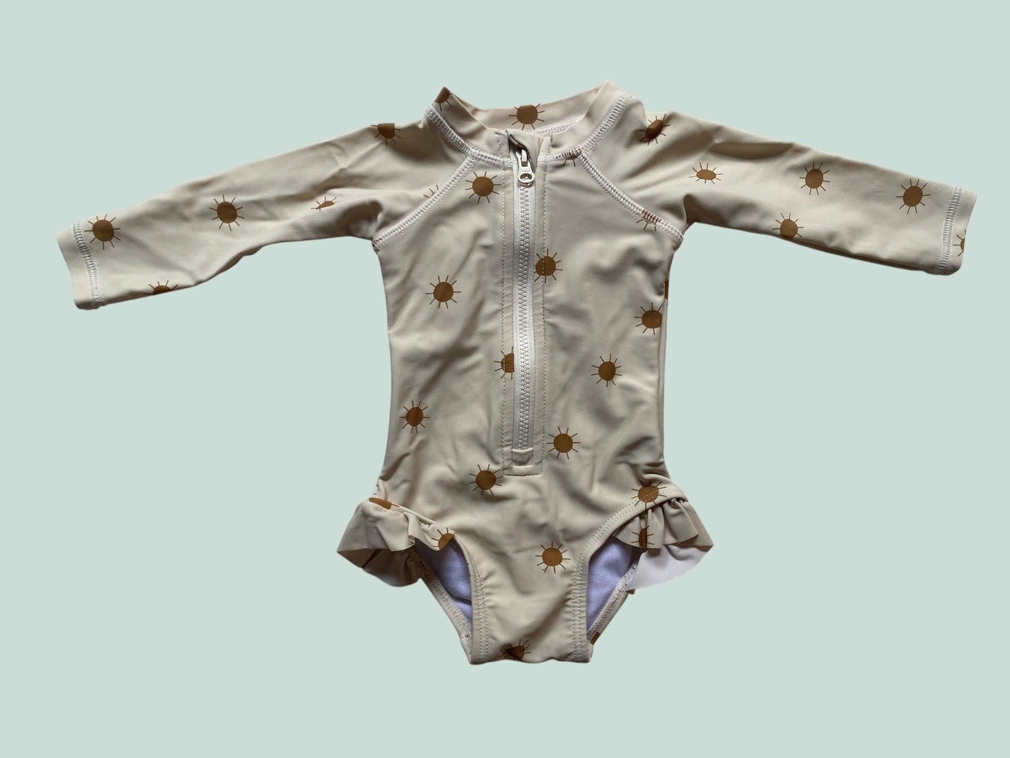 Cream coloured swimsuit with suns 0-3m | Rylee & Cru