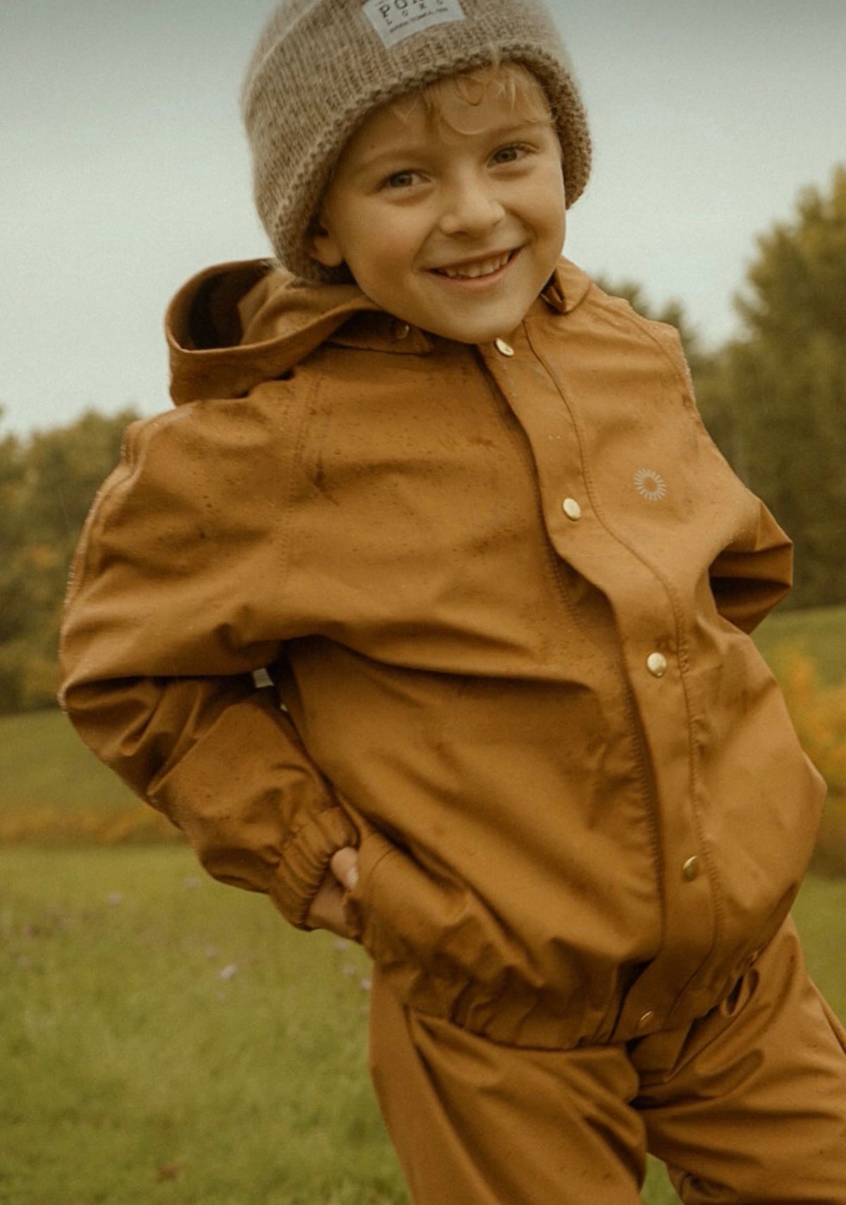 Rust coloured "Aviator" rain jacket 6-8Y | Fairechild