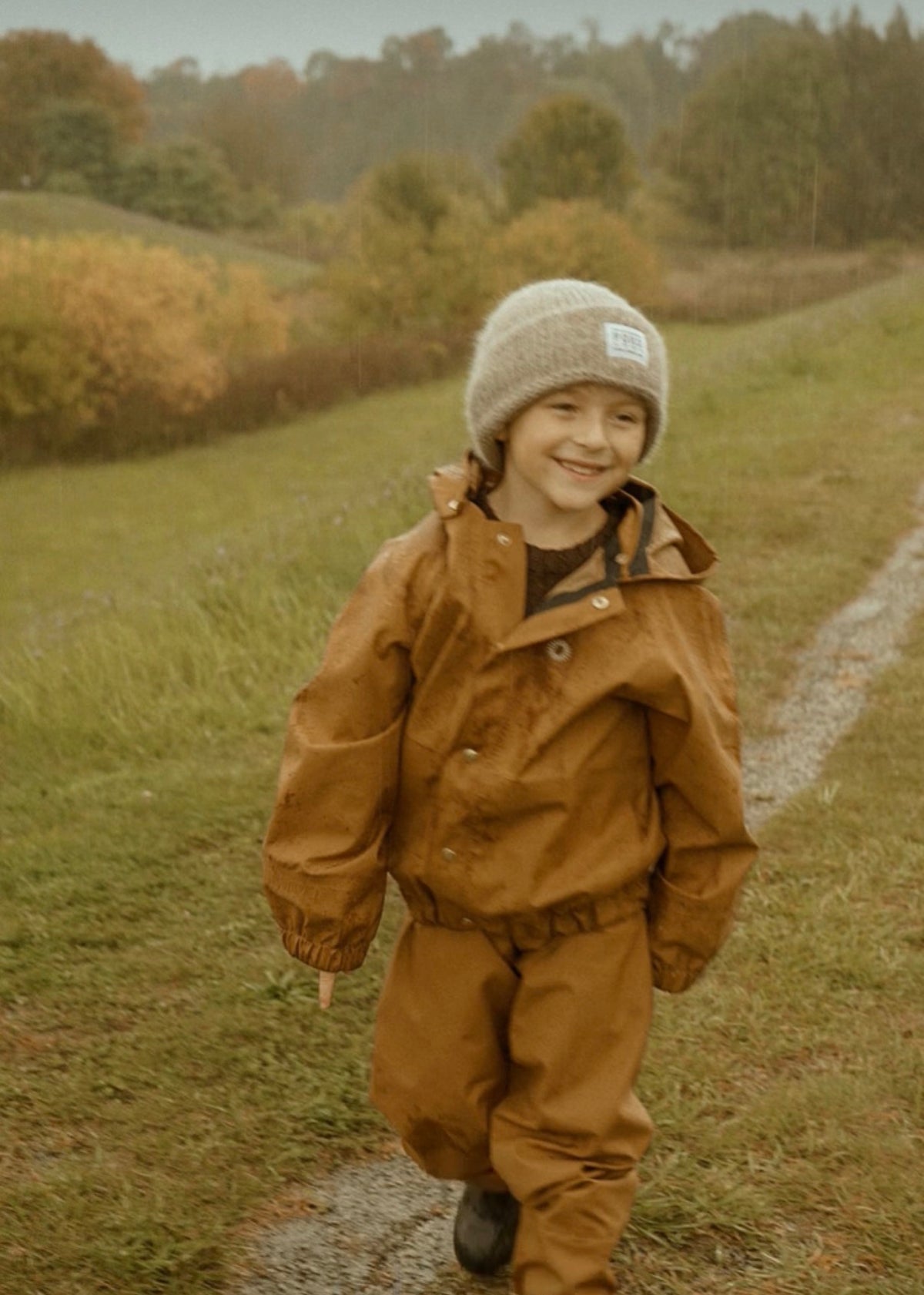 Rust coloured "Aviator" rain jacket 6-8Y | Fairechild