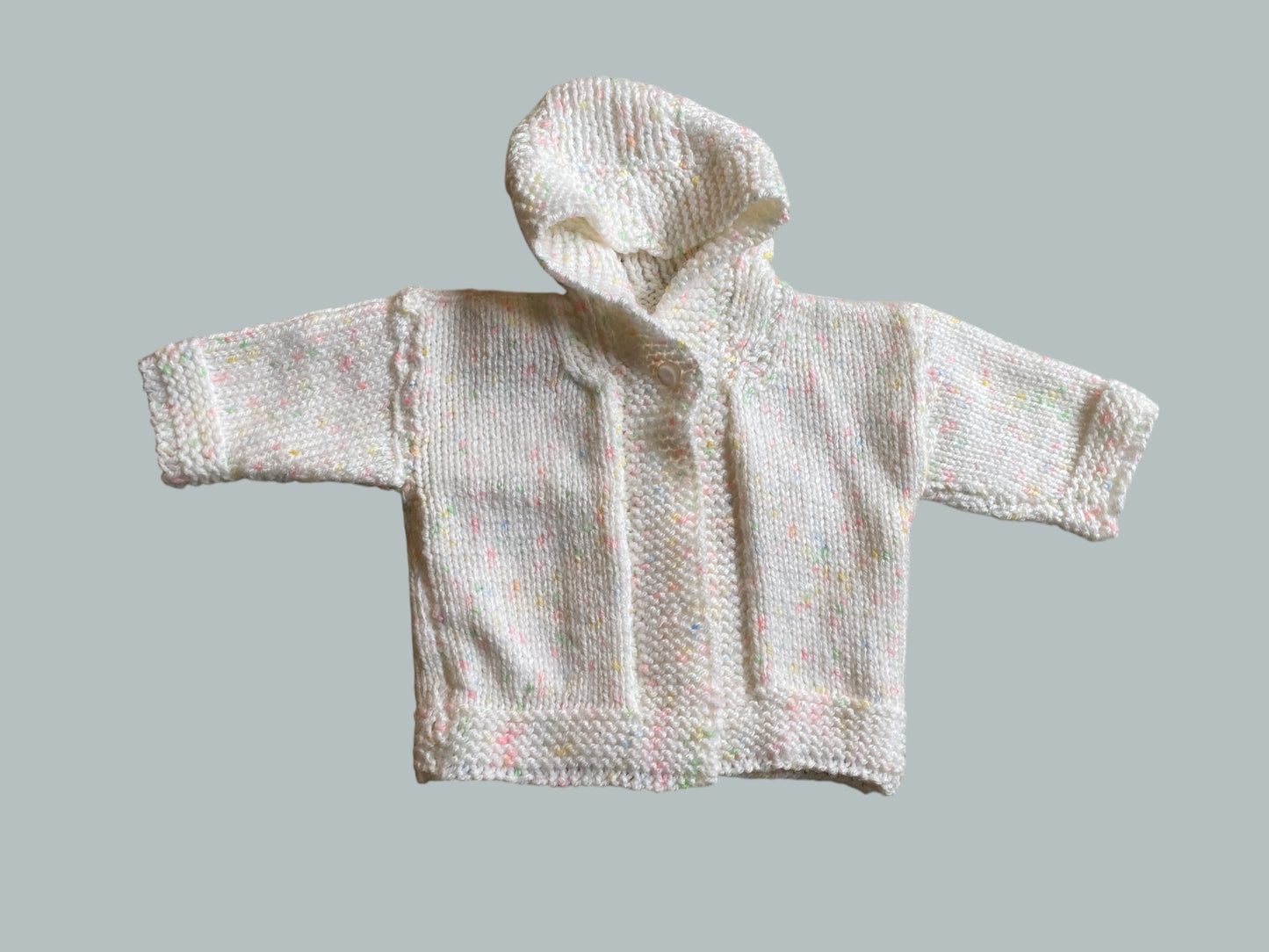 White hand knit hoodie cardigan with rainbow speckles 0-6m